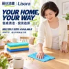 Blue Dining Table Cleaning Cloth — Multiple Size Options A woman in a cream cardigan wipes breakfast crumbs from a wooden dining table with a blue patterned cloth beside turquoise, yellow and blue folded cleaning sheets.