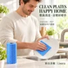 Blue Nonwoven Kitchen Cloth for Cleaning Plates A man cleans a white ceramic plate with a blue patterned cloth beside a kitchen sink, with a blue nonwoven cleaning roll on the counter.