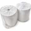 Two white pearl-embossed disposable nonwoven hair-drying towel rolls, individually wrapped in clear plastic bags and arranged against a white background.